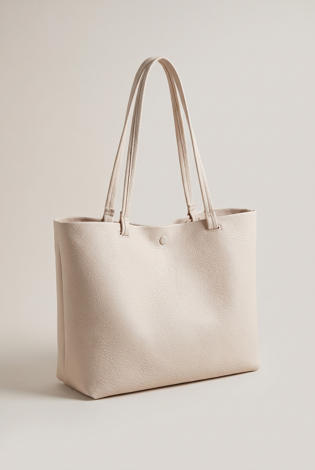 Reyna minimalist tote in beige - angle view
