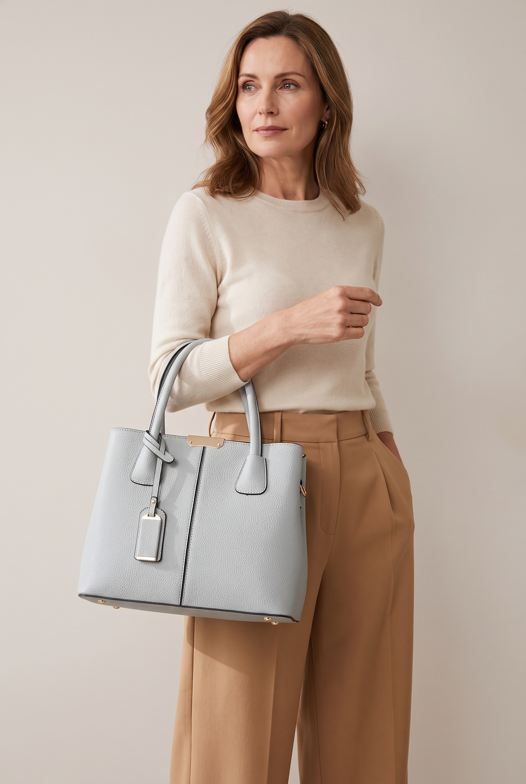 Elnora top-handle tote in light grey - carried on the arm